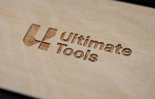 Ultimate Tools has rebranded. This is a sample of the new logo, engraved in a plank of wood.