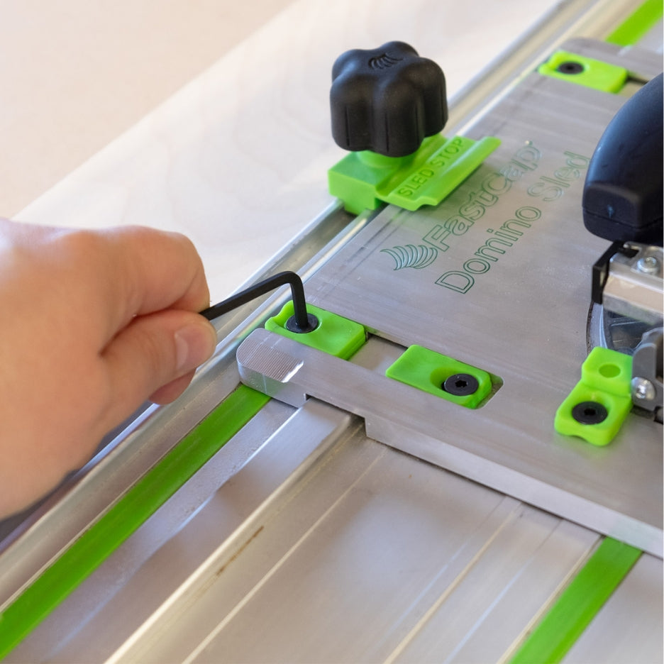 Adjustable locking tabs allow Sled to be used with multiple track/fence brands