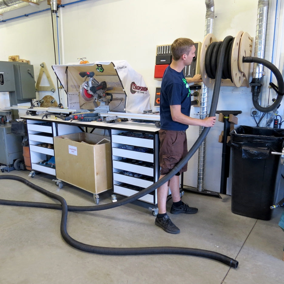 Man pulling hose from Fastcap SUPER REEL