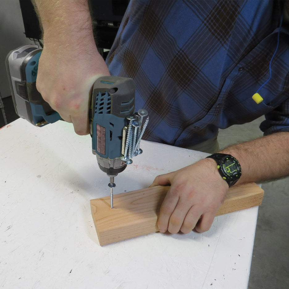 Man using screw gun with Fastcap Screw Gun Mag attached