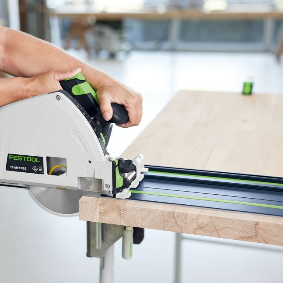 Hands holding track saw running on FS 1400 limited edition 100 years guide rail