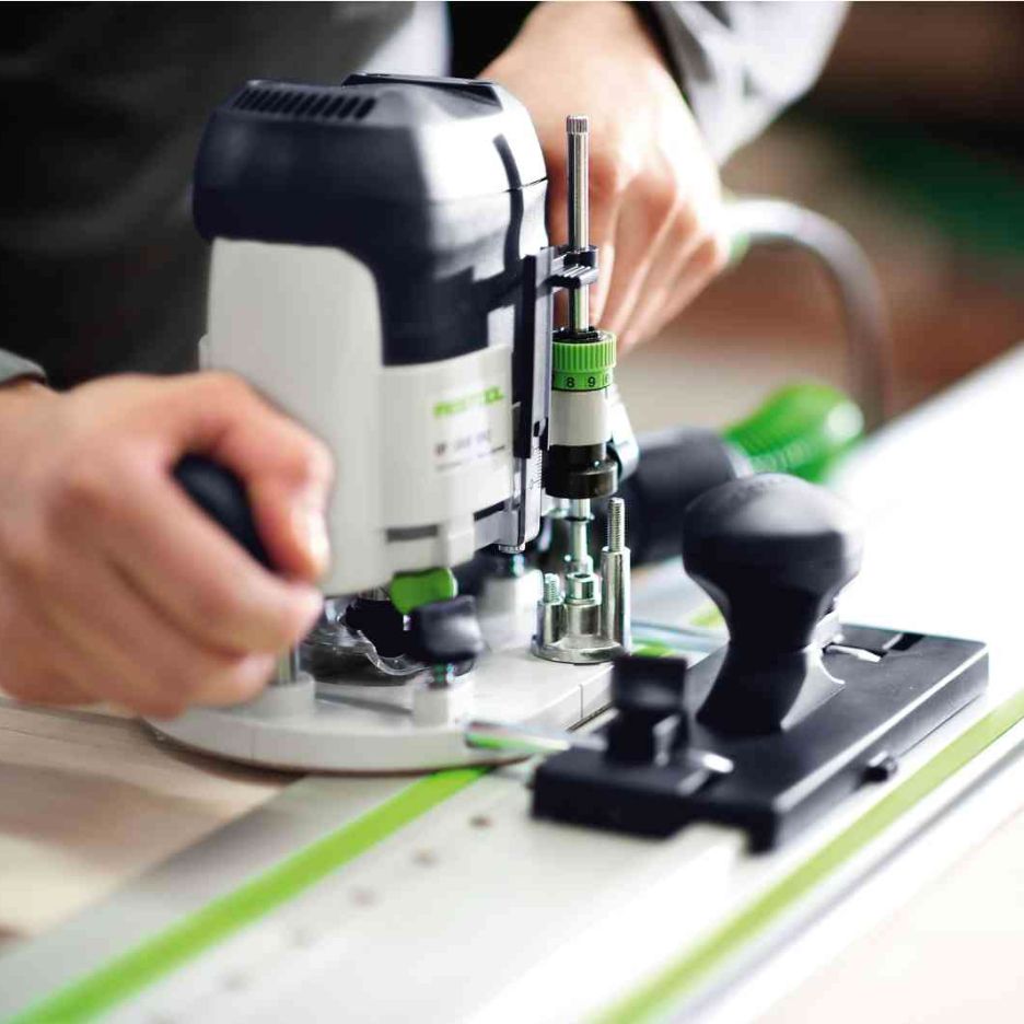 Festool router being adjusted for use with Festool 1400mm Guide Rail with LR32 Holes FS 1400/2