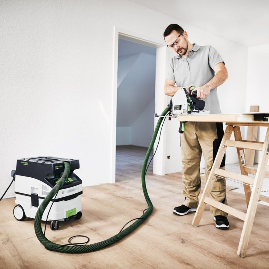Man using a track saw attached to Festool 15 Litre Cleantec HEPA Dust Extractor with Autostart and Bluetooth CT Midi I HEPA