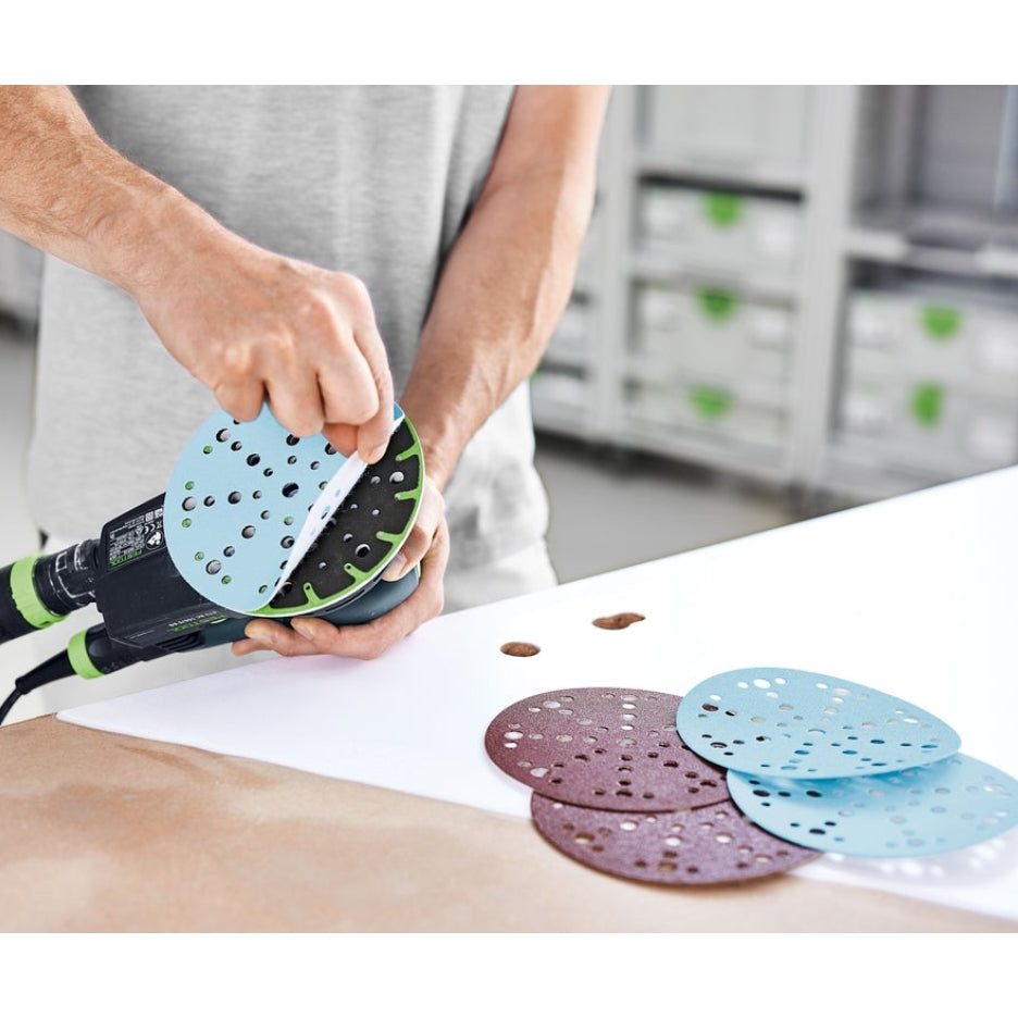 Granat abrasive being placed on sander