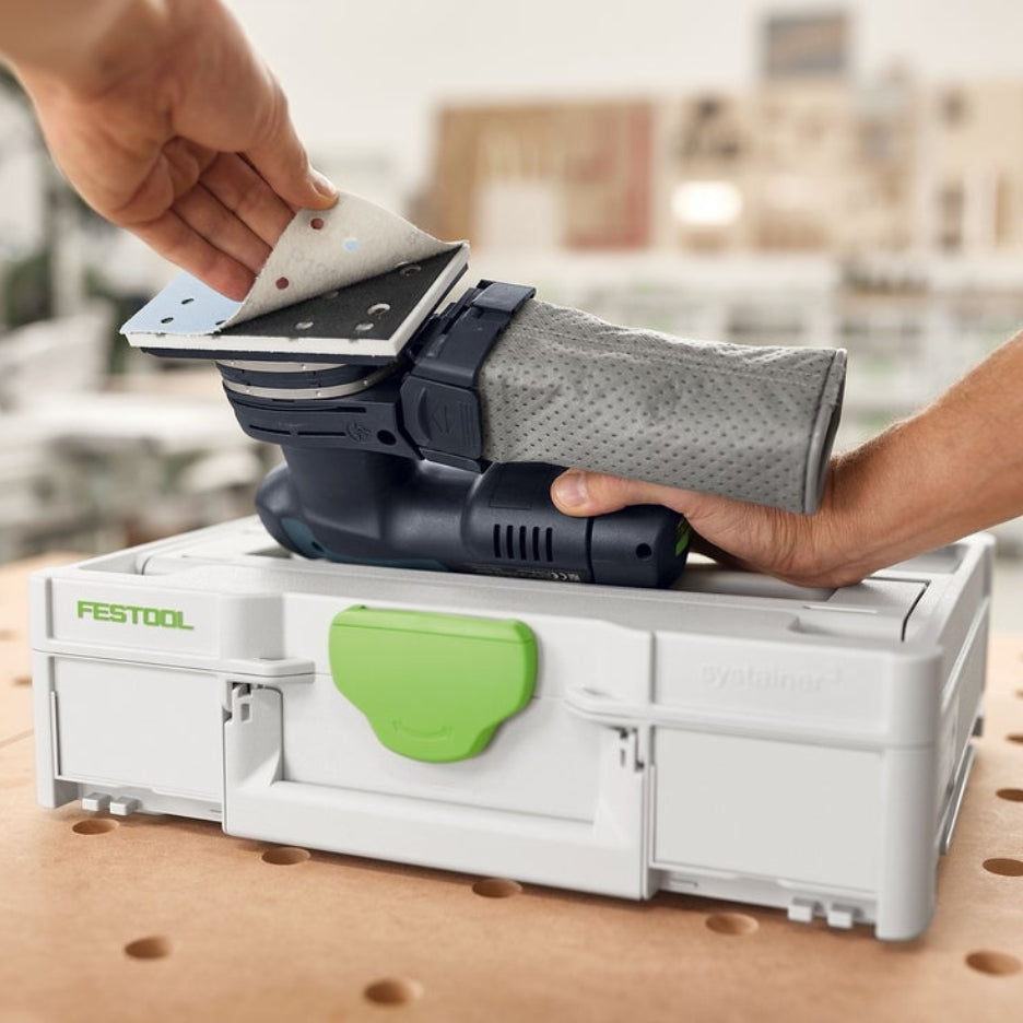 Hands removing Granat abrasive from sander on top of Systainer