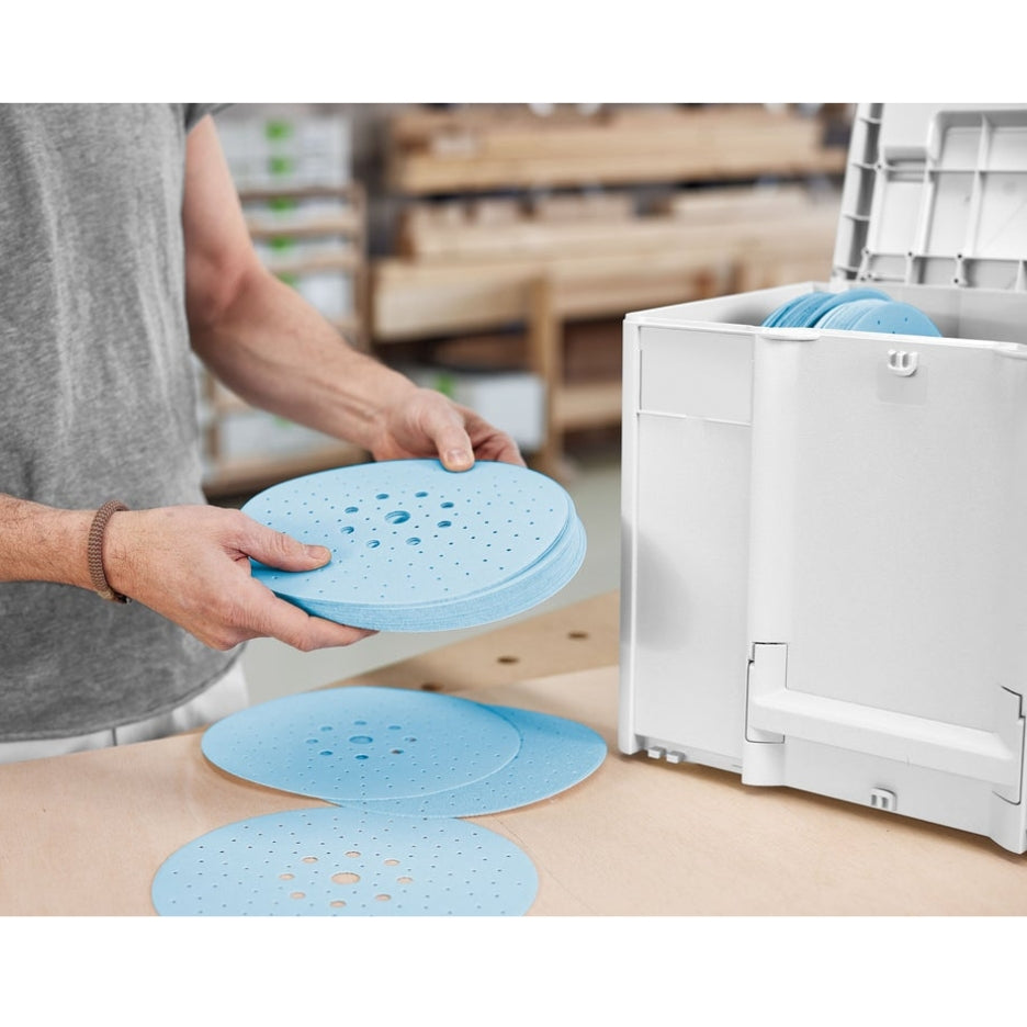 Hands holding pile of Granat abrasives