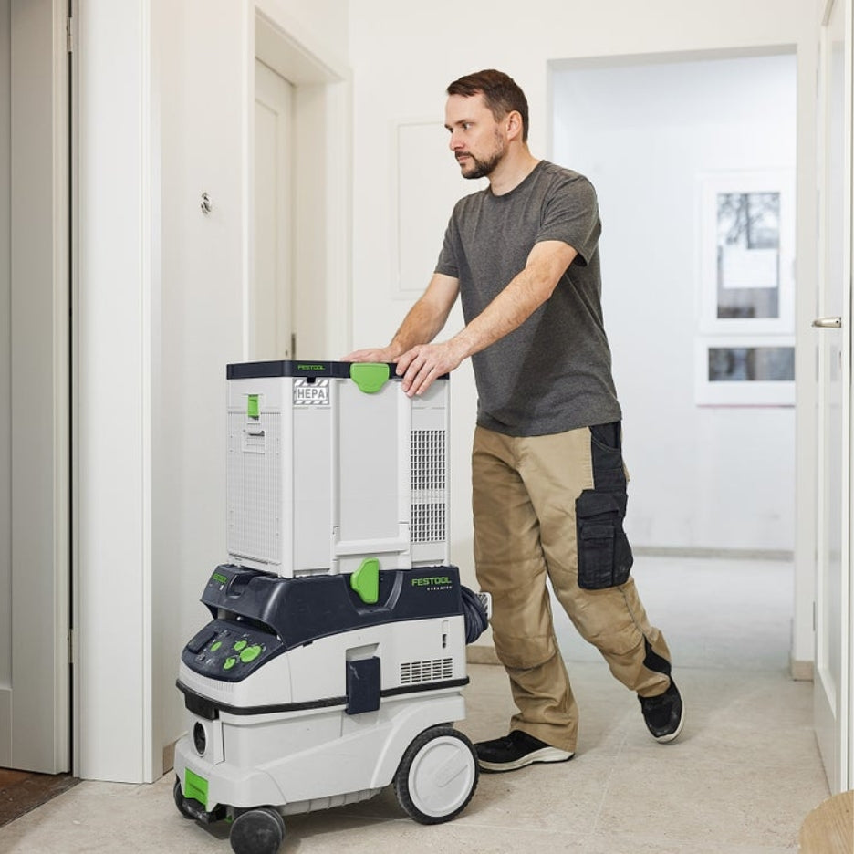 Man pushing Festool Air Filter SYS-AIR HEPA on top of dust extractor