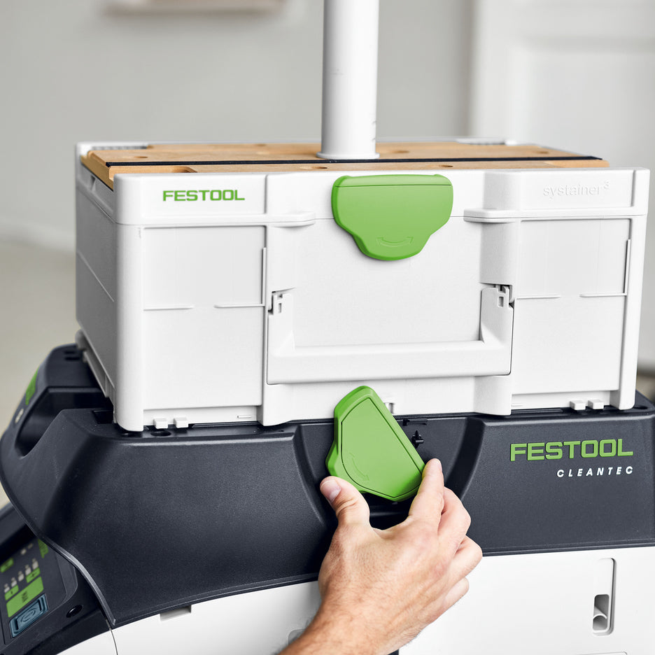 Festool Boom Arm attaches to a SYS-MFT, which is connected to a dust extractor with the T-Loc latch.