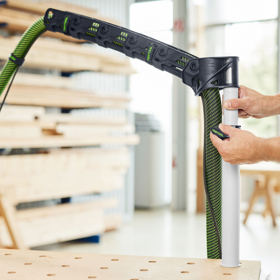 Festool Boom Arm uses a telescopic arm that can be raised or lowered. The post can be mounted to an MFT multifunction table.