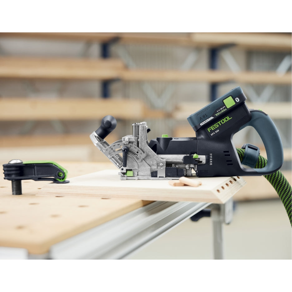 Side view of Festool Cordless Domino Joiner DFC 500 on a workpiece