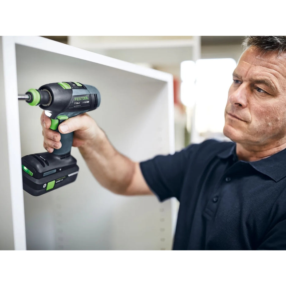 Man using Festool Cordless Drill T 18+3 on a white cabinet.