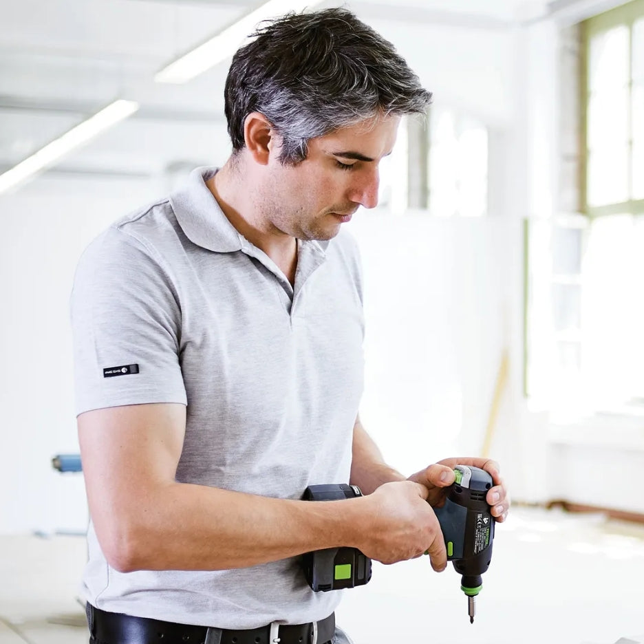 Man using Festool Cordless Drill T 18+3 in a bright indoor setting