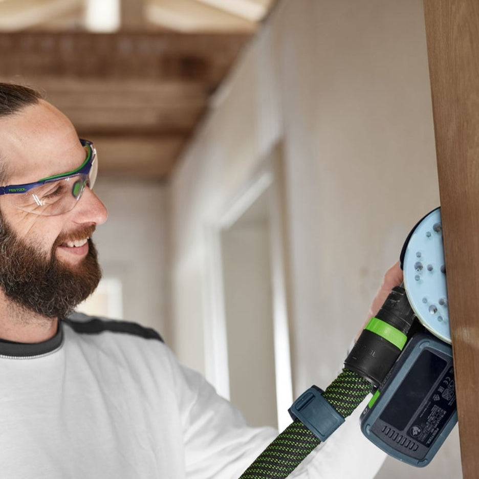 Man sanding wood beam with Festool ETSC 2 150