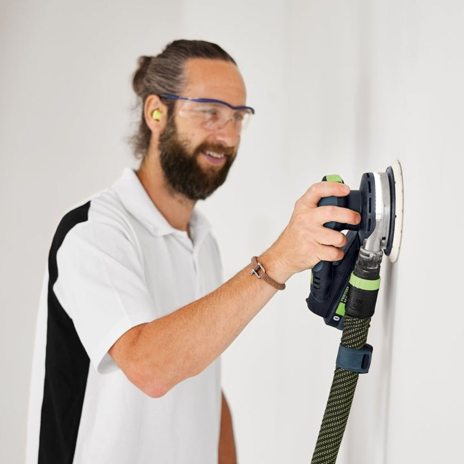 Man sanding wall using ETSC 2 150