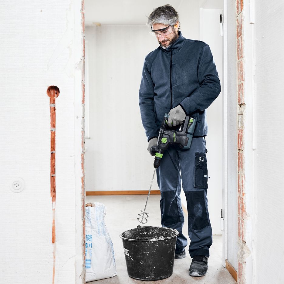 Man using Festool KHC 18 to mix concrete