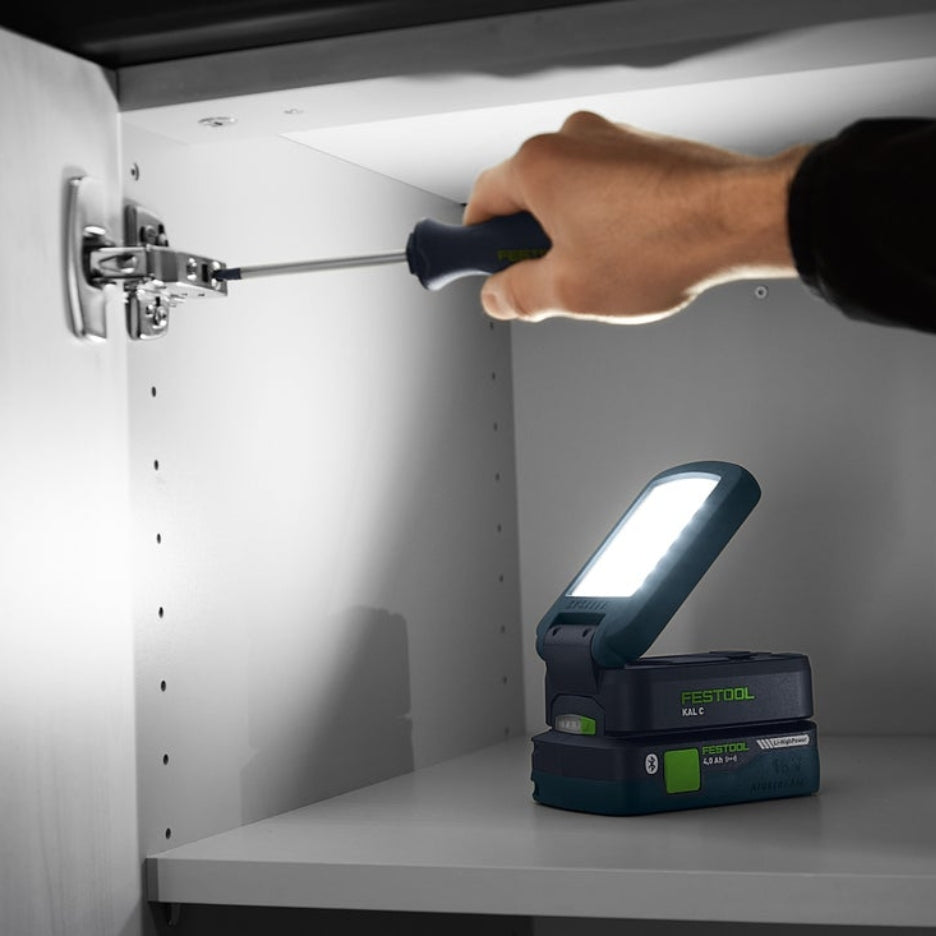 Festool Cordless Task Light SYSLITE KAL C used inside cabinet to illuminate door hinge area
