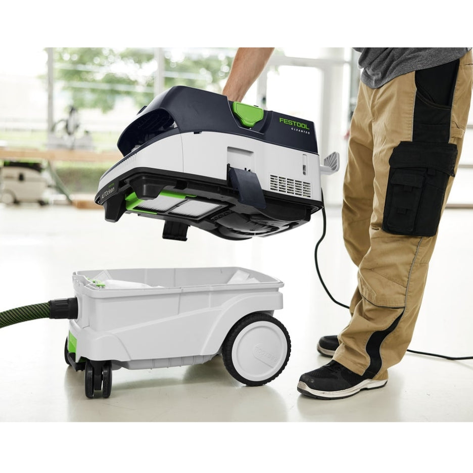 Man opening Festool CT 26 and showing filter container