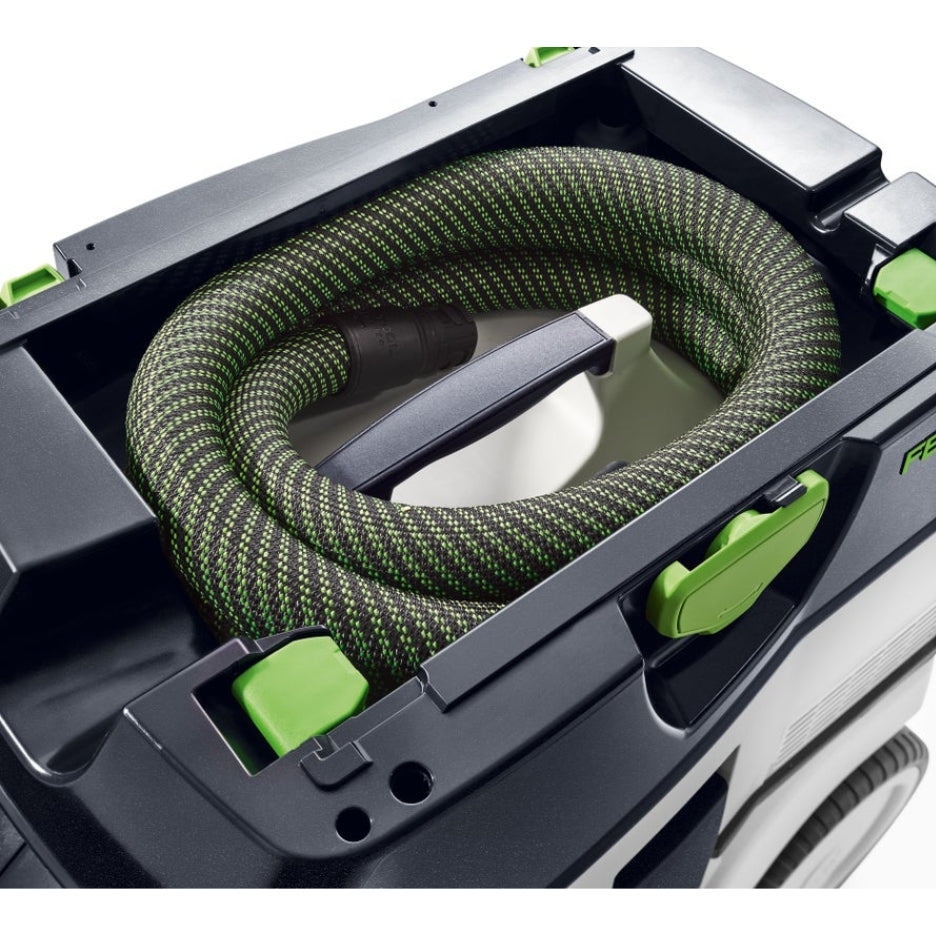 The power cable and suction hose are neatly stored in the built-in hose garage, keeping everything organized and well-protected during transit.