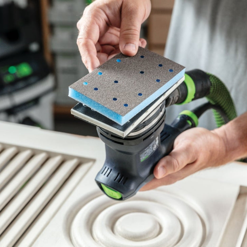 Person holding Festool Grit Abrasives Granat PROfile 80x133 M GR PRO close to Festool sander