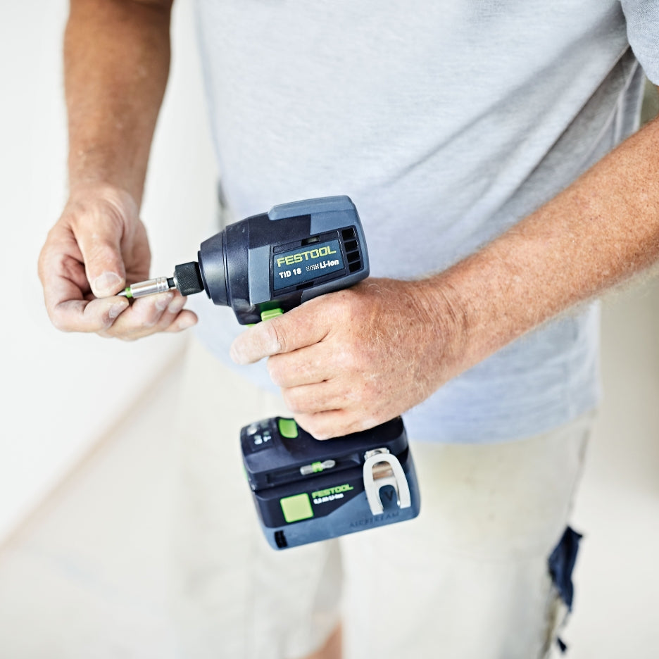 Hands holding Festool Impact Driver and inserting bit