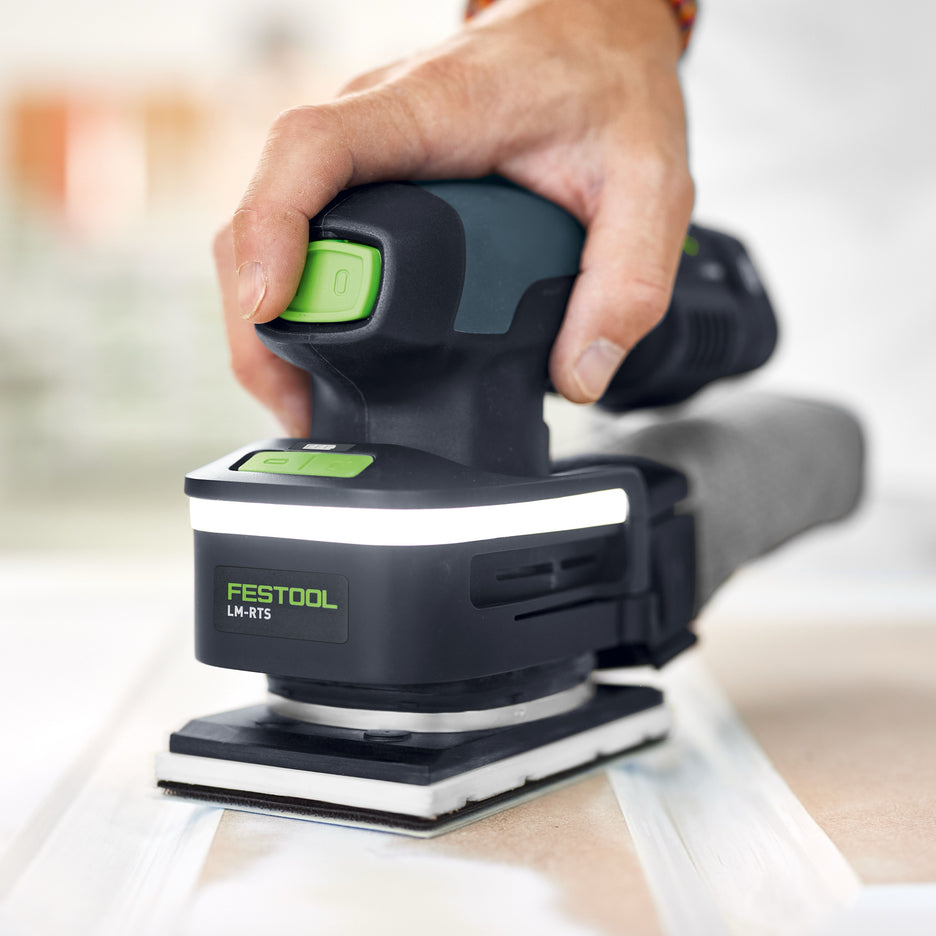 Festool LM-RTS light module clipped onto orbital sander higher up the body for more light near the sanding pad.