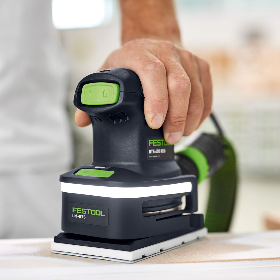 Festool LM-RTS Light Module clipped onto orbital sander in low position ready to sand