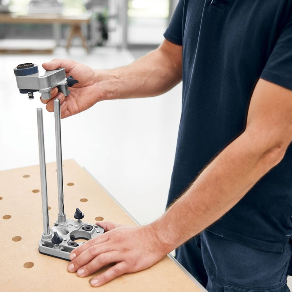 Person holding pieces of Festool Mobile Drilling Attachment MB 40