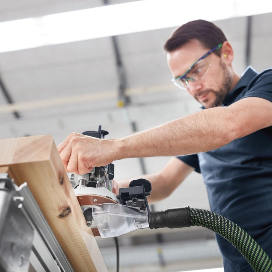 Man rounding off wooden piece edge