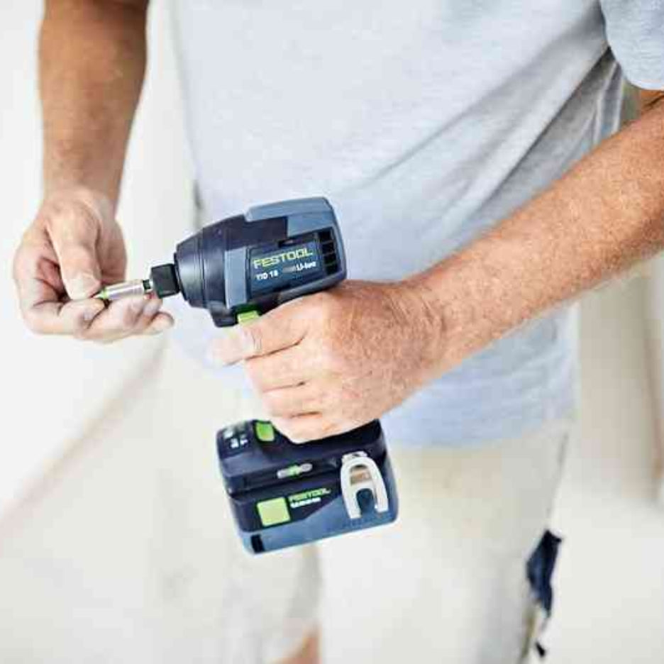 Man attaching a bit to Festool TID 18 cordless impact screwdriver