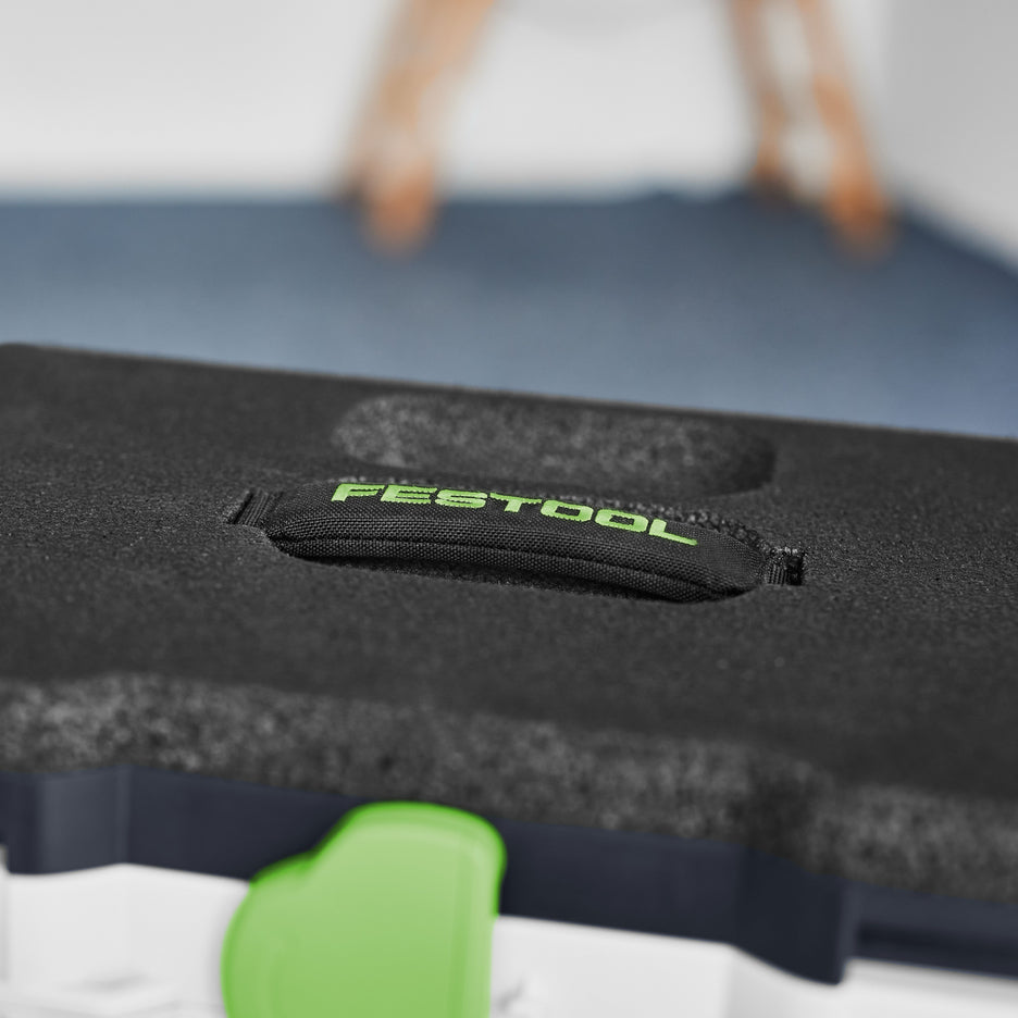 Detail photo of the padded carry handle, with small parts recess in the background.