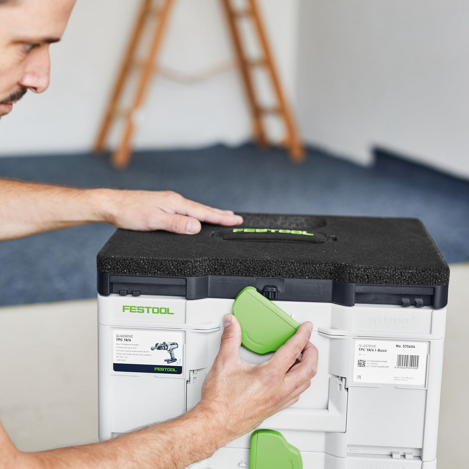 Man connects Seat Cushion to a stack of Systainers with T-Loc latch.