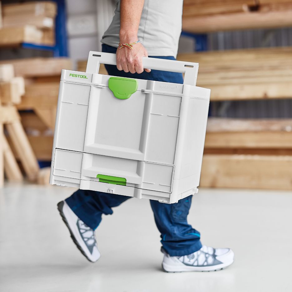 Person carrying Festool Systainer SYS3-COMBI M 287 by its handle