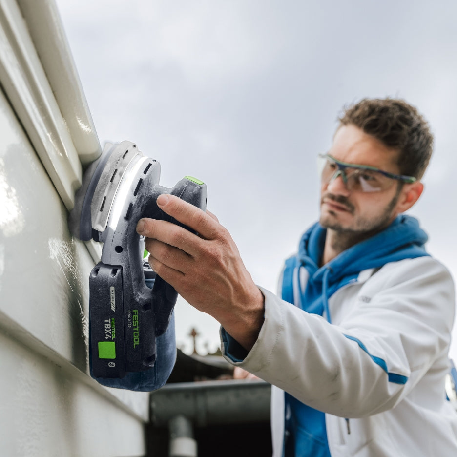 Man using Festool sander with Festool Tabless Battery