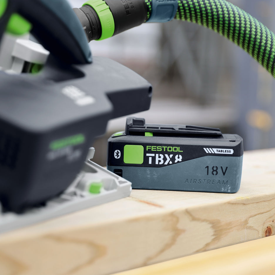 Festool TBX 8 Tabless Lithium-Ion Battery Pack next to track saw on wood