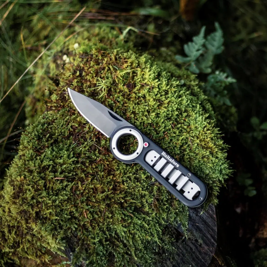 Hultafors Outdoor Folding Knife open on moss