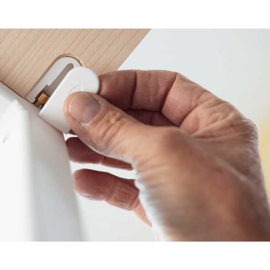 Hand attaching Lamello Cabineo X cover cap