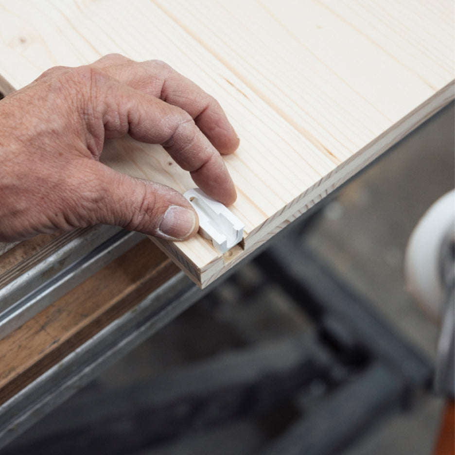 Hand attaching Lamello Cabineo X connector to wood