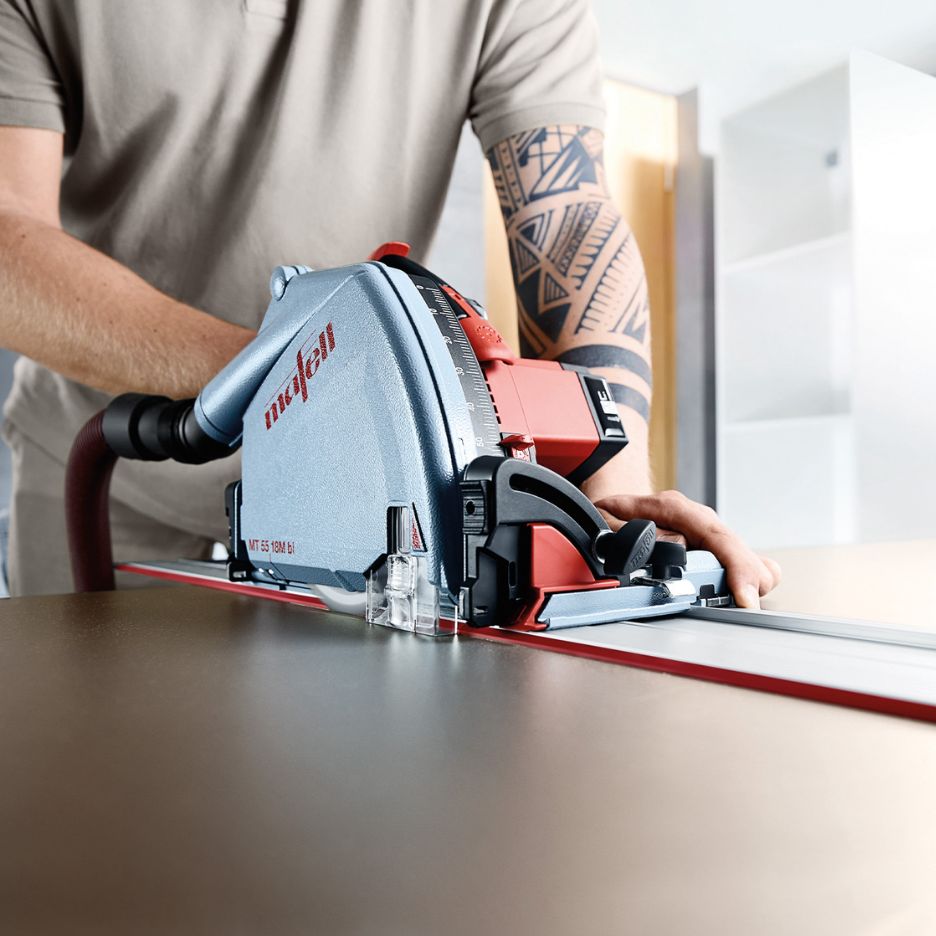 Man using Mafell Cordless Plunge Cut Track Saw MT 55 18M bi on rail