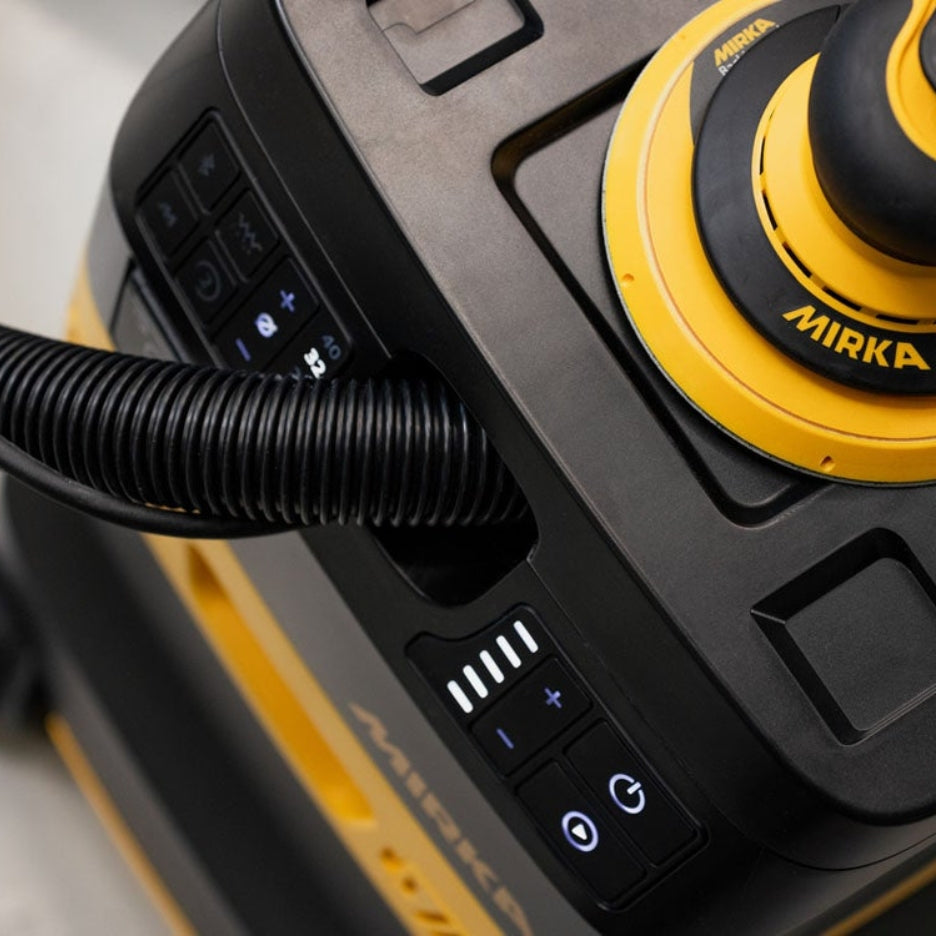 Close-up of Mirka DEXOS 30 Litre Dust Extractor 1230X M HEPA AFC with sander on top