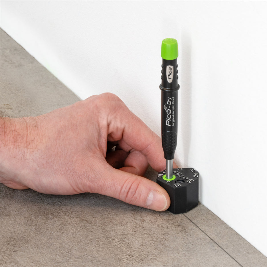 Pica Dry Pencil in Scriber marks a floorboard parallel to the wall.