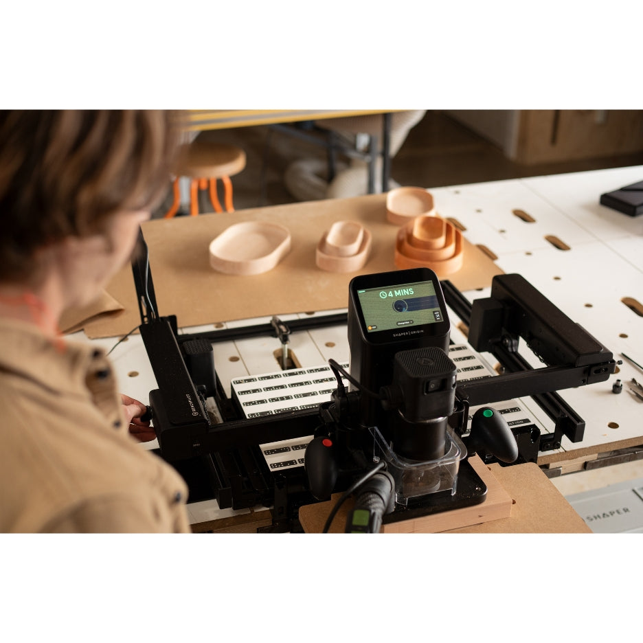 Person looking at Shaper Tools BenchPilot attached to Origin and Workstation