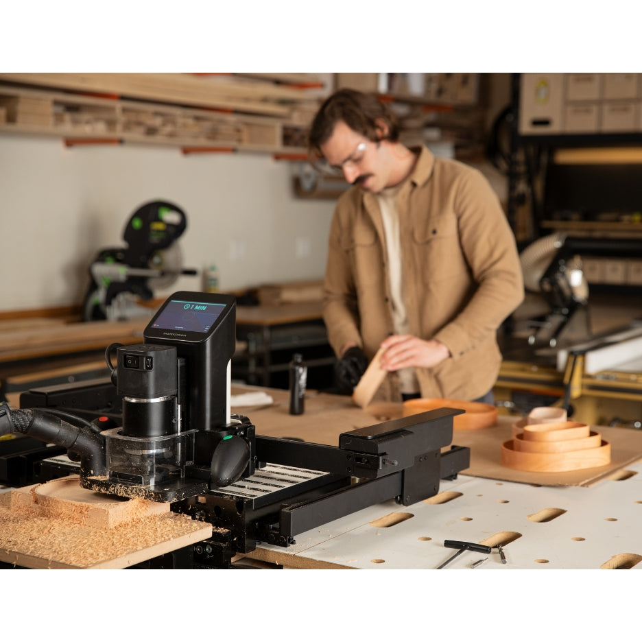 Shaper Tools BenchPilot attached to Origin and Workstation and man in the background