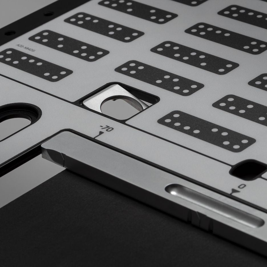 One of four flag stops flipped down to register Plate perpendicular against the workpiece.