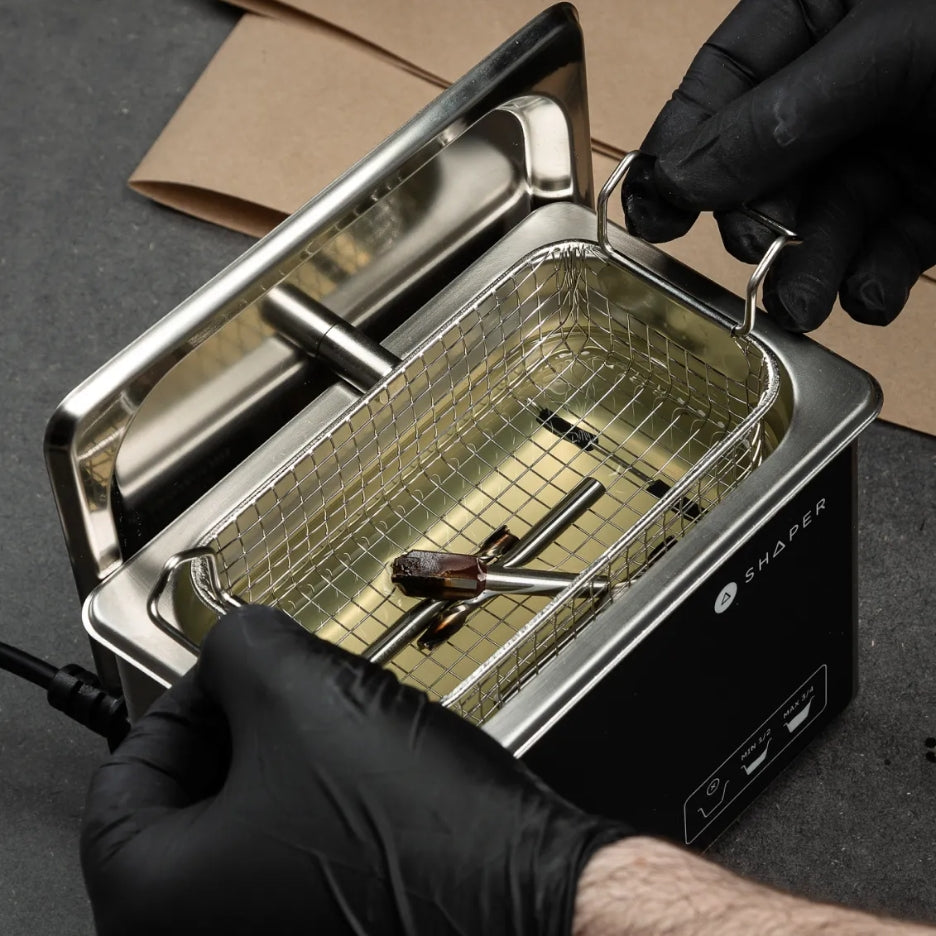 Bits being inserted in the ultrasonic router bit washer basket