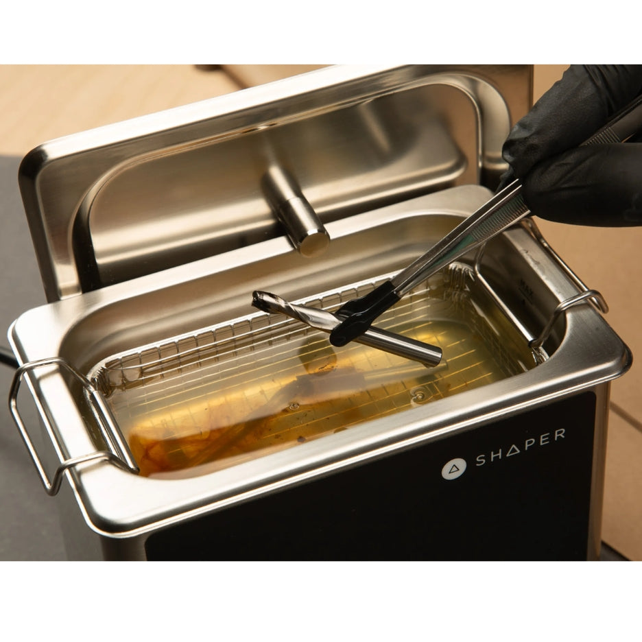 Clean router bit being removed from Shaper Tools Ultrasonic Bit Washer