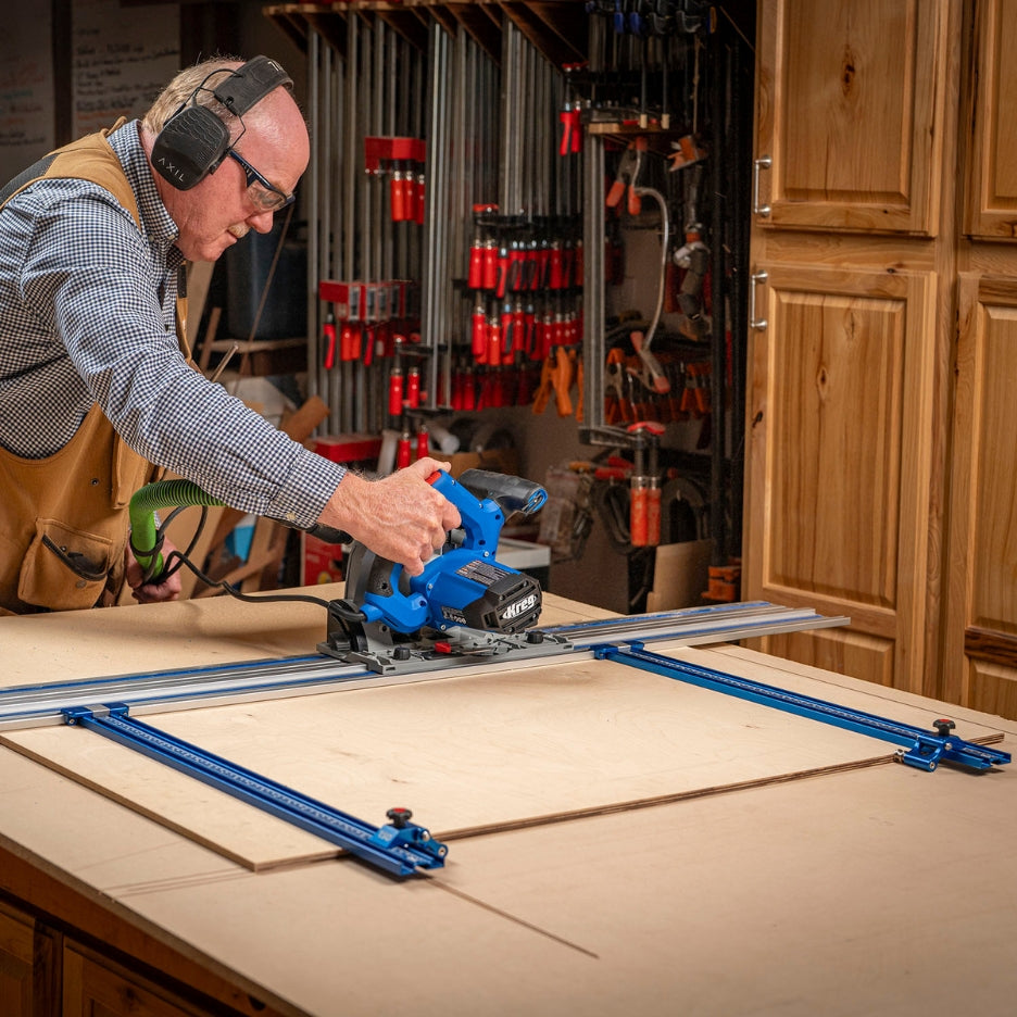 Man using a track saw on a guide rail being held by TSO Products Parallel Guide System Gen 2