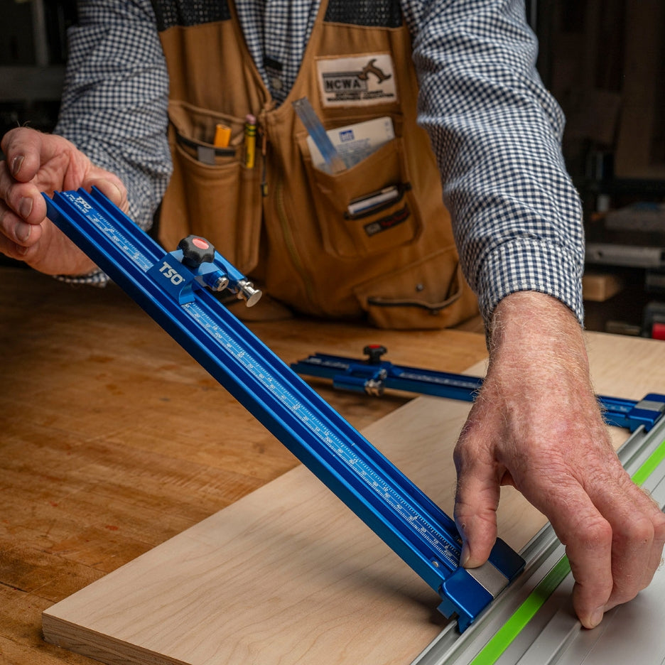 Man attaching Parallel Guide Track to guide rail using TSO Products Drop-Loc Connector
