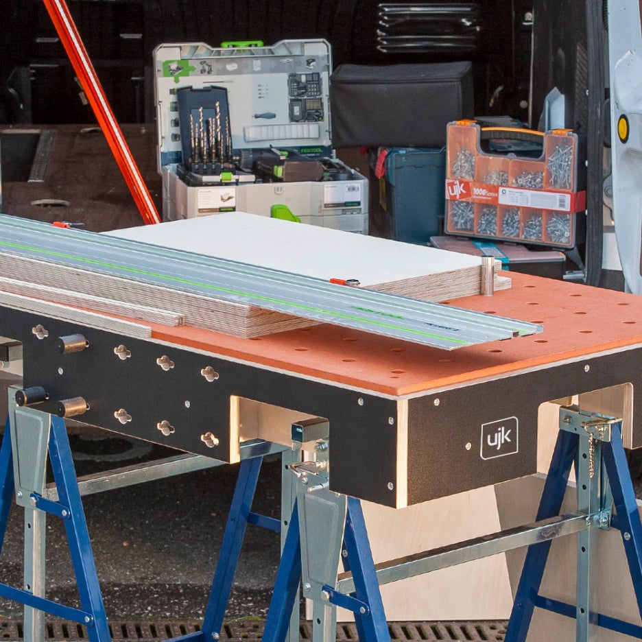 Workbench and UJK Tools HDF Valchromat Top for Parf Dogs on top, with tools and materials in a workshop setting