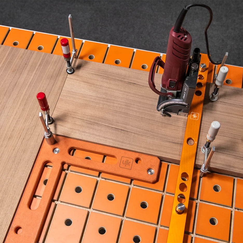 UJK Tools Rail Clamp MFT Top with wood pieces being held by clamps and a joiner on top