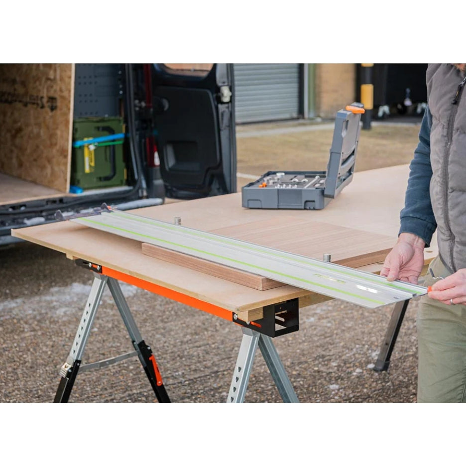 Person using UJK Tools Sawhorses with wood and a guide rail on top
